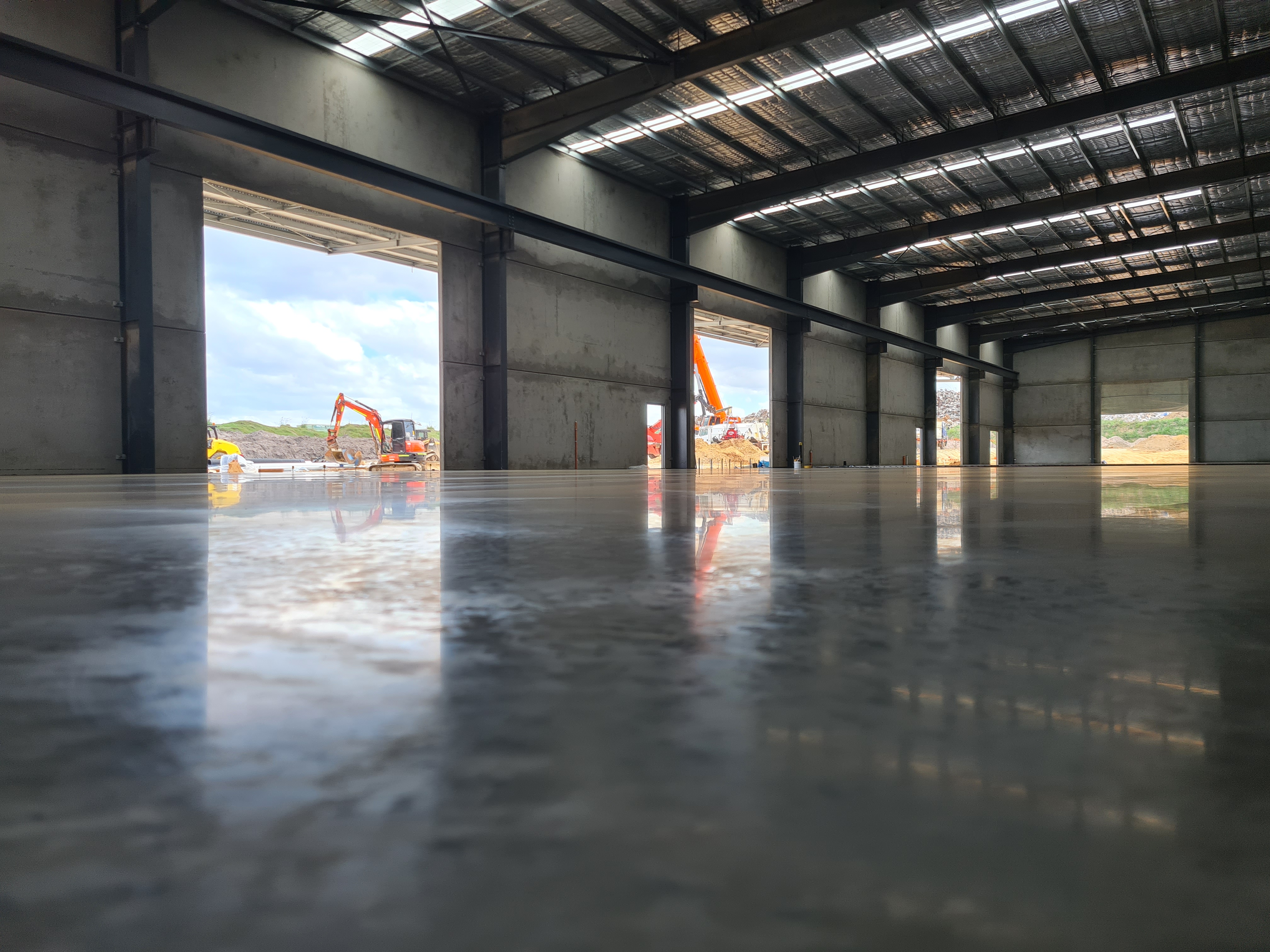 QTM Enterprises warehouse — burnished floor finish