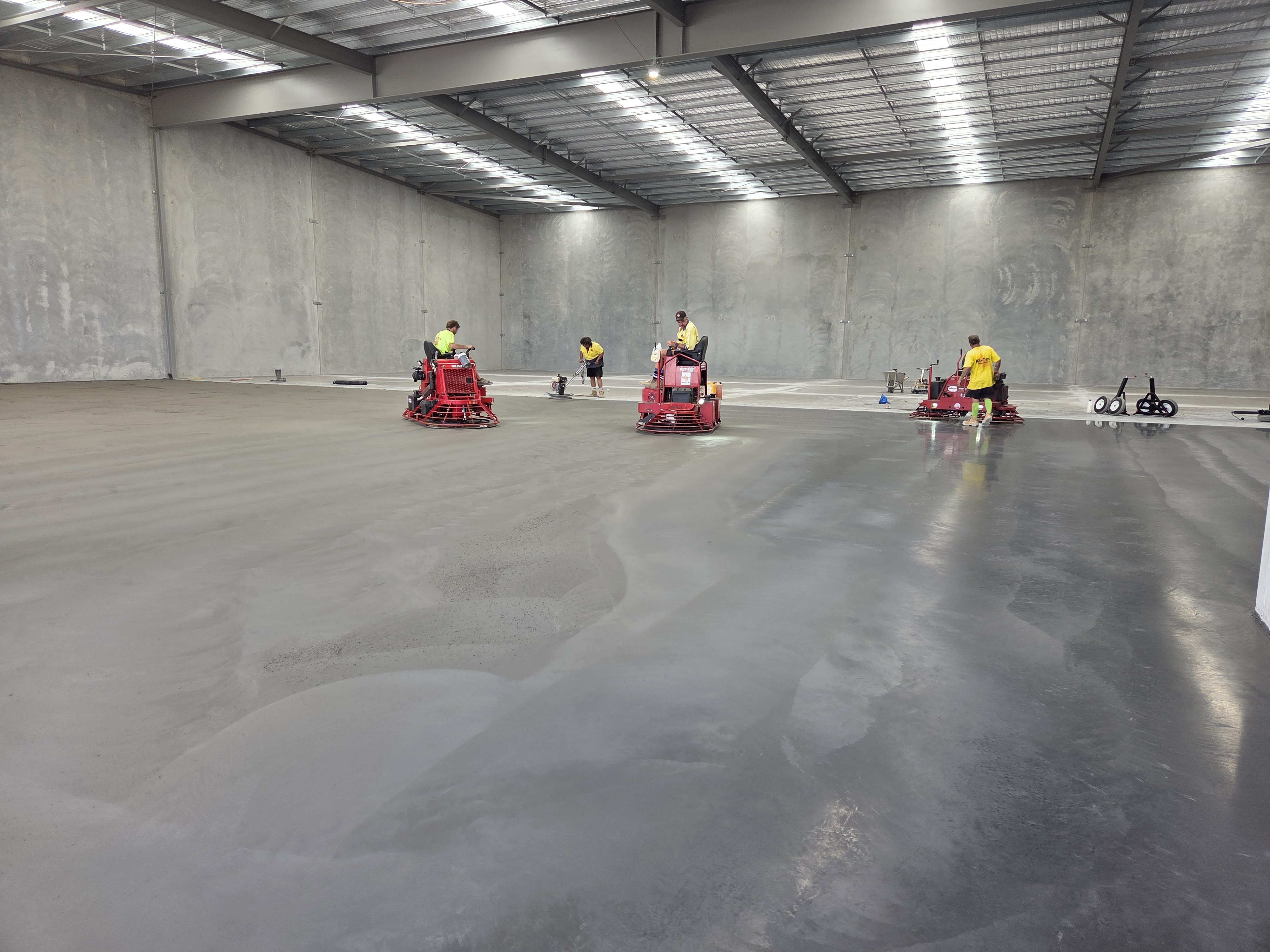 Industrial slab — power trowelling team