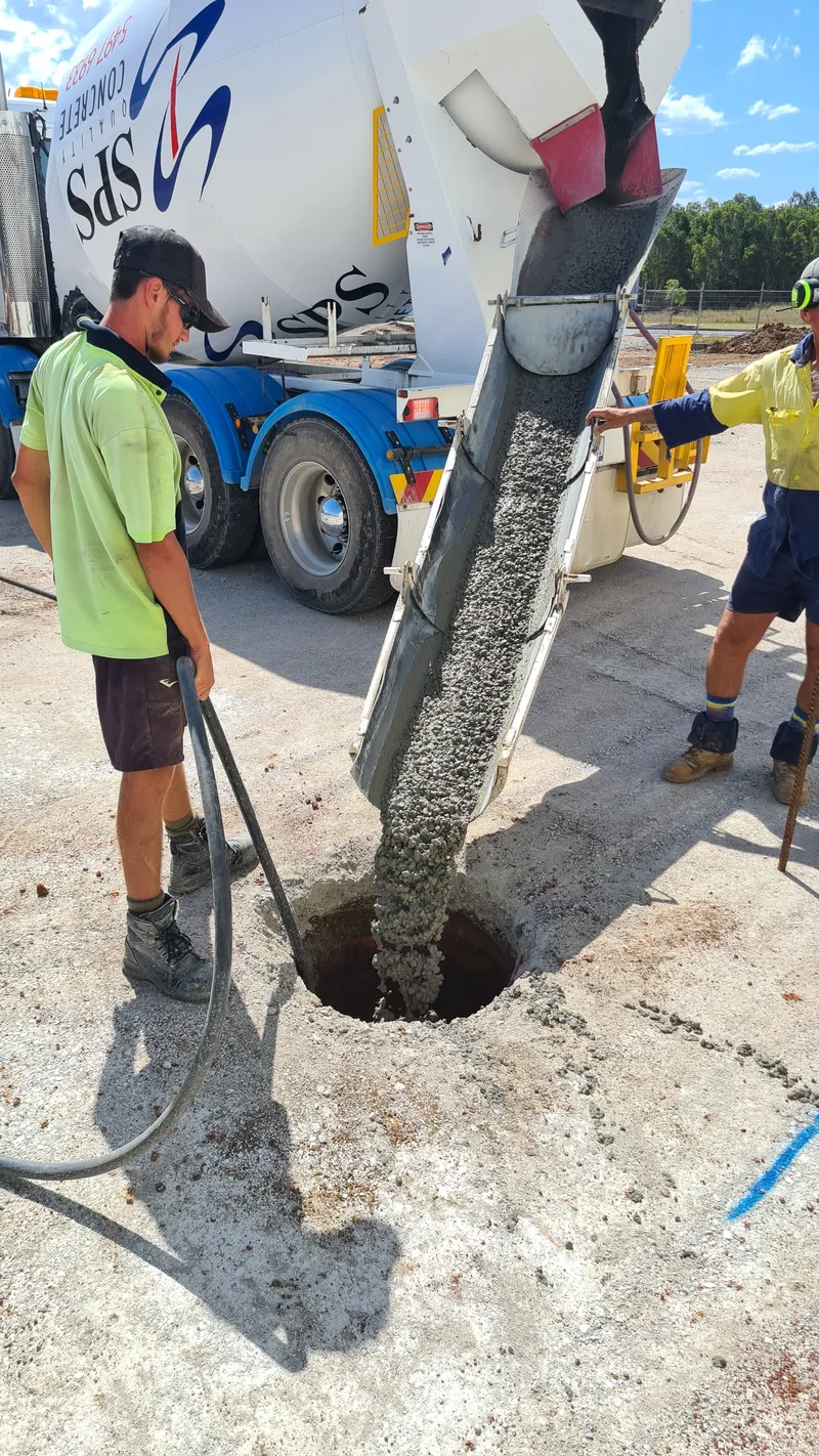 Industrial bored piers — pouring SteelX concrete from agitator