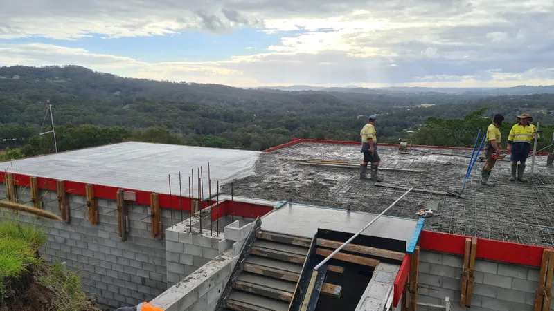 Exposed roof slab — concrete pour with hinterland views