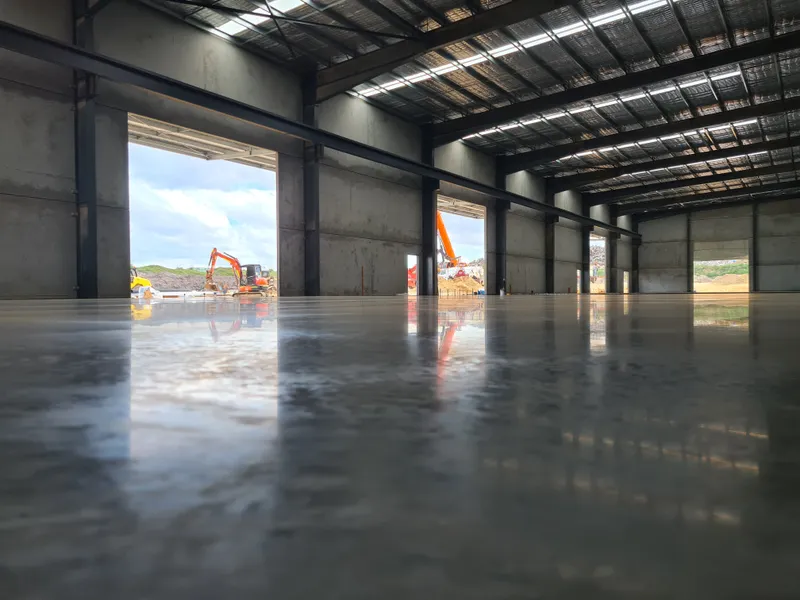 QTM Enterprises warehouse — burnished floor finish
