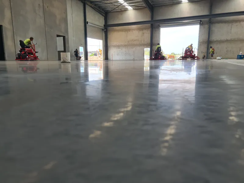 QTM Enterprises warehouse — power trowelling