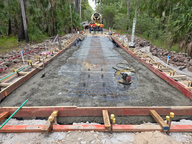 Defence causeway — concrete pour with rebar in bush setting